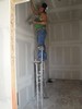 l. The Stilt Man applying mud to the Sheetrock (101) (384x512, 53.0 kilobytes)