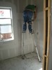 l. The Stilt Man applying mud to the Sheetrock (103) (384x512, 58.0 kilobytes)