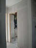 l. The Stilt Man applying mud to the Sheetrock (104) (384x512, 42.0 kilobytes)